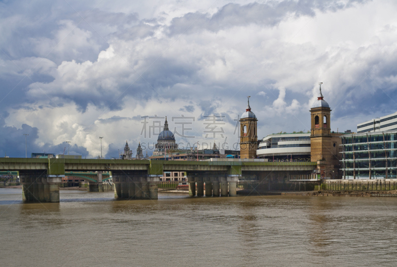 Railway Bridge and St Paul’s Cathedral dome seen across Thames in London