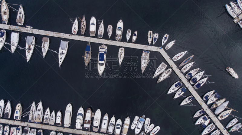 Many boats moored to floating pontoons in Istanbul ,Fenerbahçe.Top view of the large yacht marina. Aerial view by drone