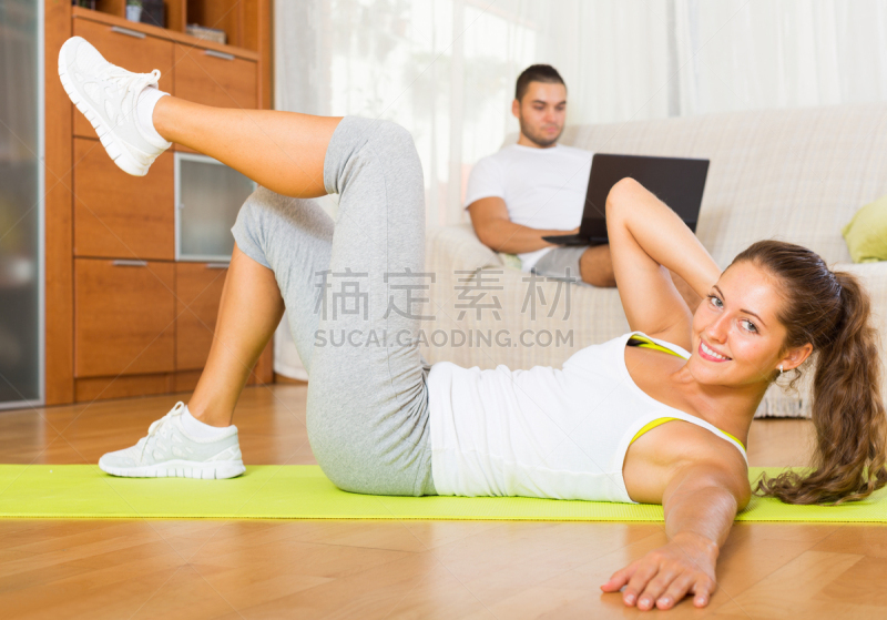 female training on mat and inert guy resting