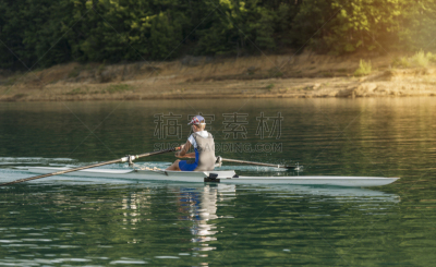 A Young single scull rowing competitor