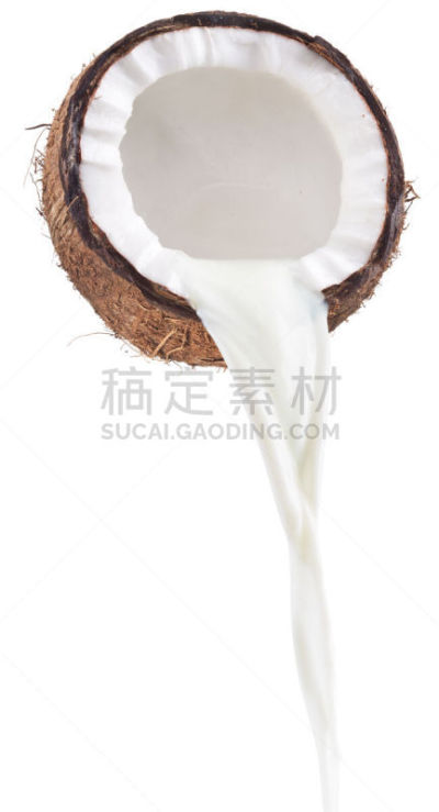 Coconut milk pouring out of coconut fruit. White background.