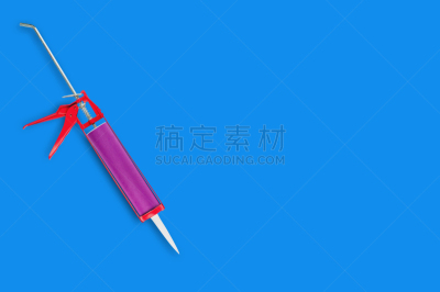 一个物体,红色,硅树脂,塑胶,金属,建筑业,胶水,装管,蓝色背景