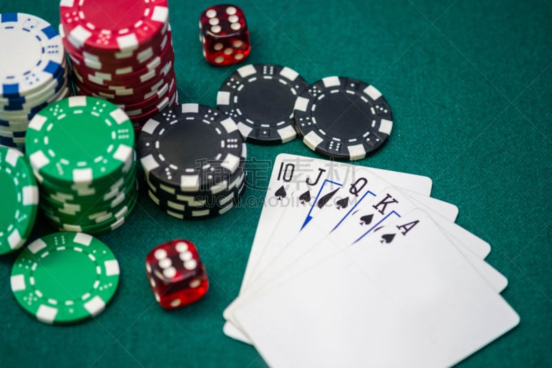 Stack of Poker Chips with dice and cards