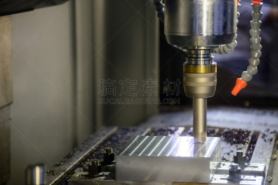 The CNC milling machine cutting cutting the raw material with the small ball-end mill tool .
