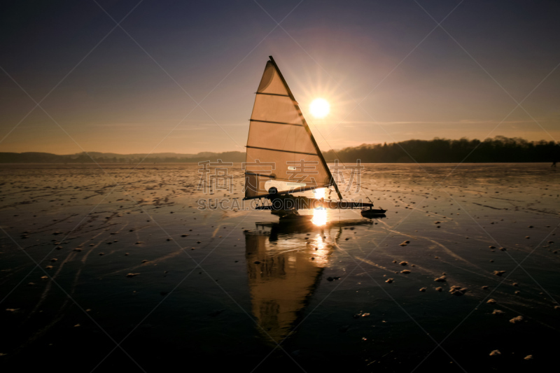 Ice Sailing on Lake Wörthsee in Bavaria, Germany at sunset