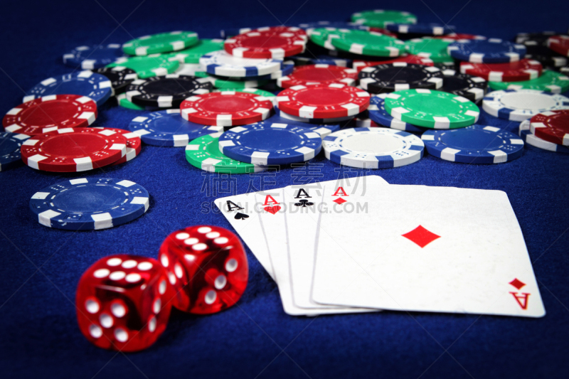 Playing cards, poker chips, and dices on the table
