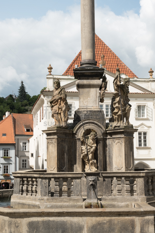 Fountain on the Square in Cesky Krumlov, Czech Republic. Statues of St Vaclav, St Vitus, St John the Evangelist, and St Judas Thaddeus in the town piazza.