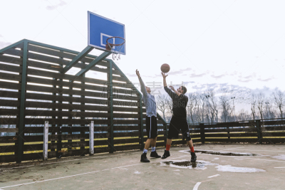 Two basketball players on the court