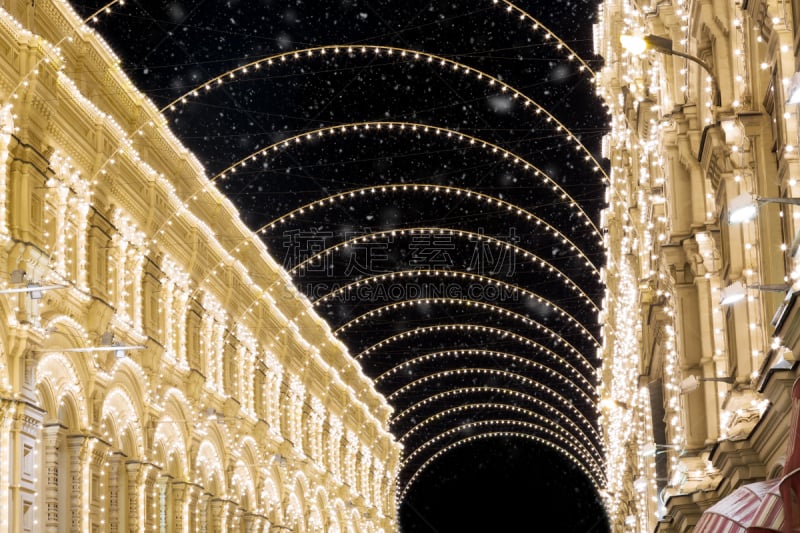 Christmas in Moscow during snowstorm. Decorated Nikolskaya street near Red Square with amazing lights decorations at night