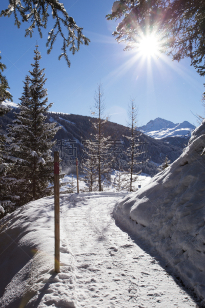 beautifull winter snowy scene  in  sunny  winter´s  day in DAVOS, SWITZERLAND. Mount jacobshorn and rinerhorn behind. horizontal