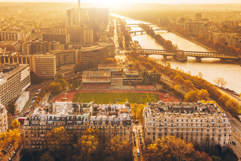 Aerial panorama of Paris City in late autumn from Eiffel Tower at sunset.