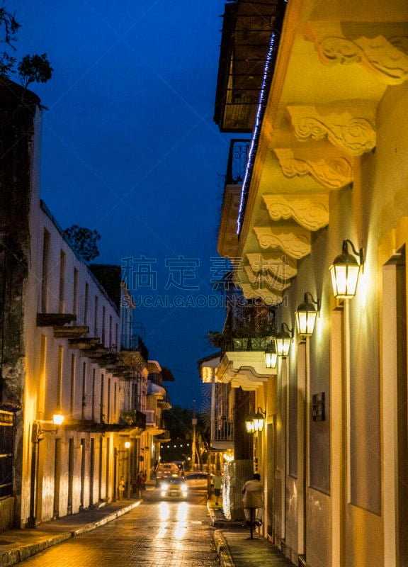 Shot at night, Casco Viejo also called Casco Antiguo, Panama City’s Old Quarter established in 1673, with its old buildings, a taxi unrecognizable persons in background.