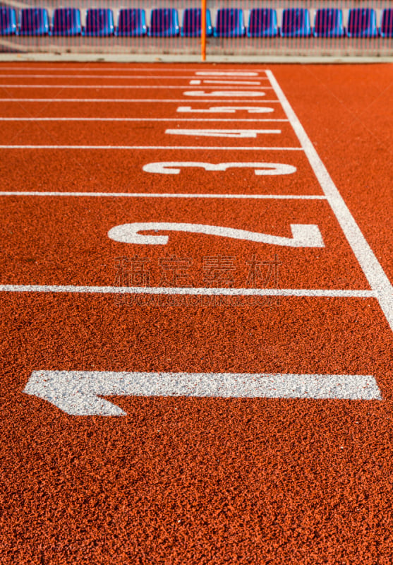 A shot of a start line at a running track.