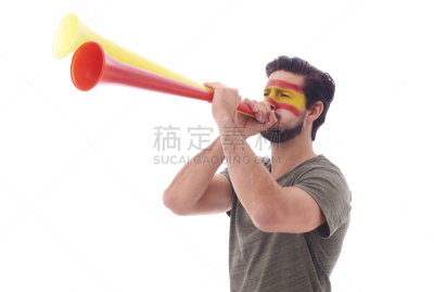 Spanish soccer fan blowing a vuvuzela