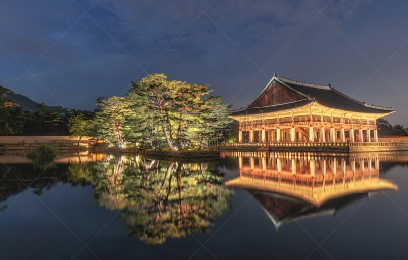 Gyeongbokgung Palace At Night in seoul South Korea,with the name of the âGyeongbokgungâ on a sign.