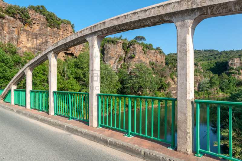 Bridge over the river La Nartuby in front of foothills of the Massif des Maures near Le Muy in the Department Var of the province Provence-Alpes-Cote d´Azur