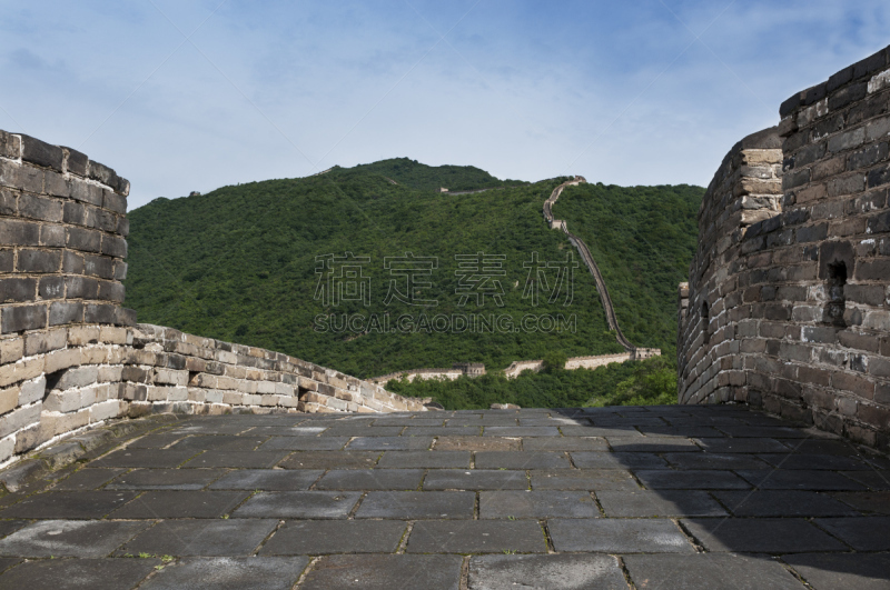 View of a section of the Great Wall of China and the surrounding mountains in Mutianyu