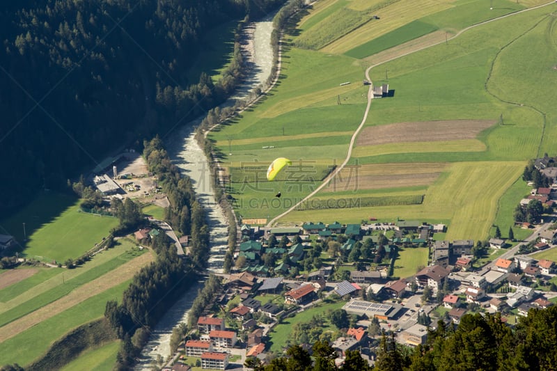 Mountains, valley and a kite surfer landscape, natural environment. Hiking in the alps. Tirol, Austria, Europe