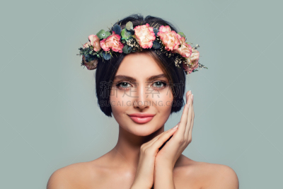 Young Healthy Woman with Flowers. Spa Model on Blue Banner Background. Skincare and Cosmetology Concept