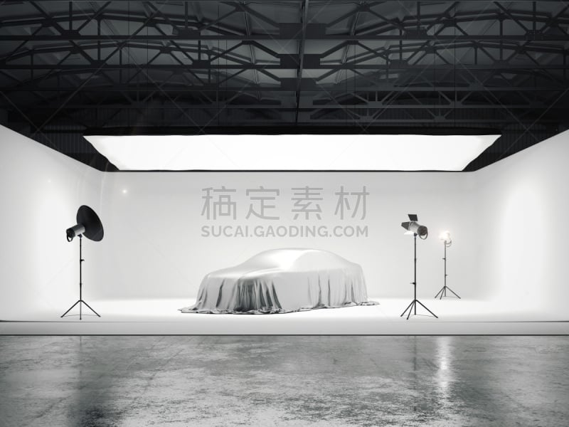 Large photographic studio with a car and several light sources. 3d rendering