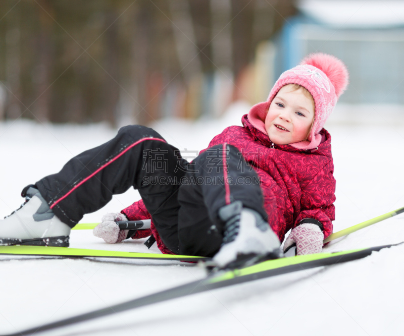 child engaged in skiing to winter