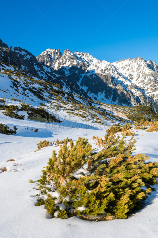 View of mountains covered with snow in five lakes valley from trail to Kozi Wierch peak, High Tatra Mountains, Poland