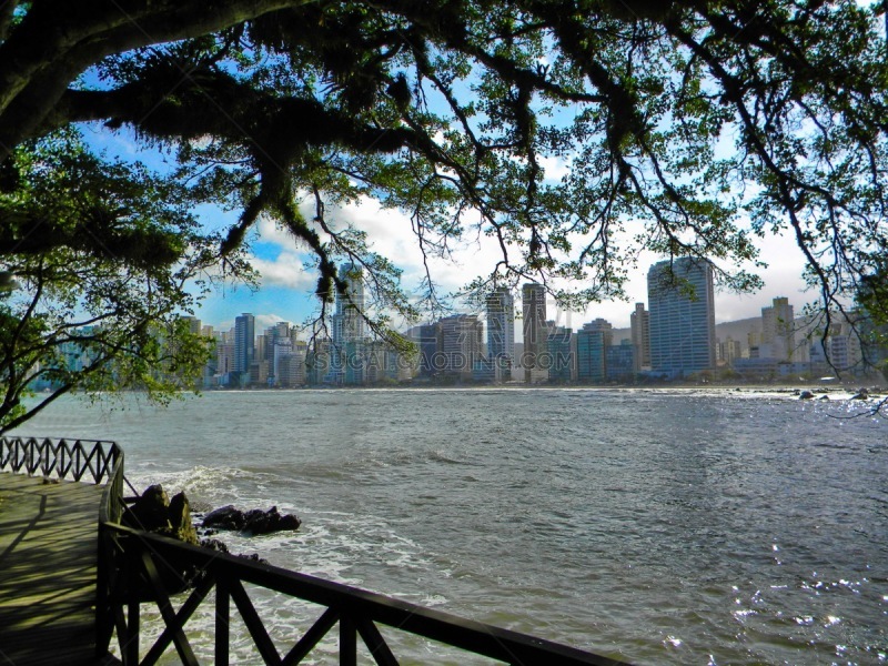 Beautiful pictures of the beautiful beach of Balneário Camboriú, with its imposing buildings, blue sea, sailboats, speedboats, extreme sports and great nightlife. An unforgettable summer season. Photo taken on the beach of Camboriú, Santa Catarina, Brazil