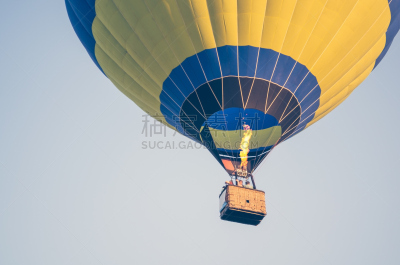 Colorful of hot air balloon with fire and blue sky background