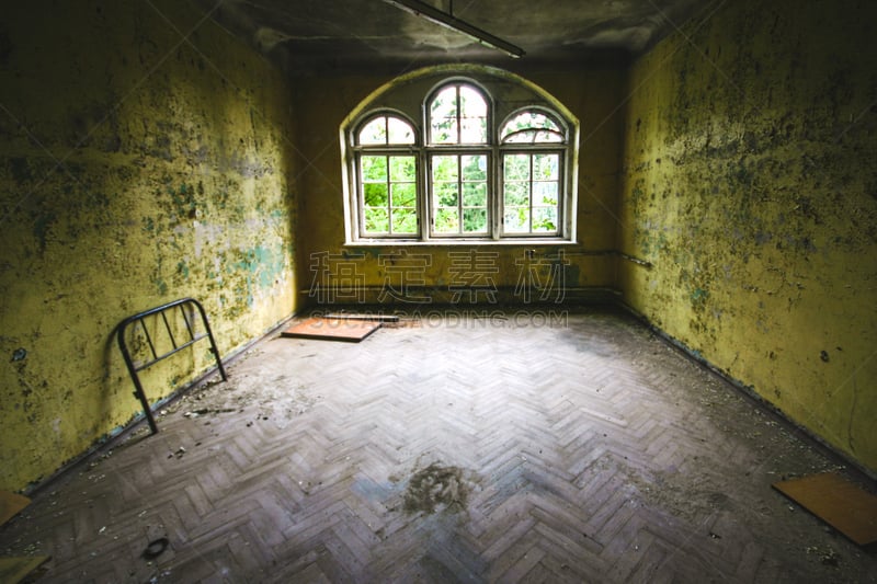 an old room with destroyed windows in an abandoned place at beelitz Heilstätten