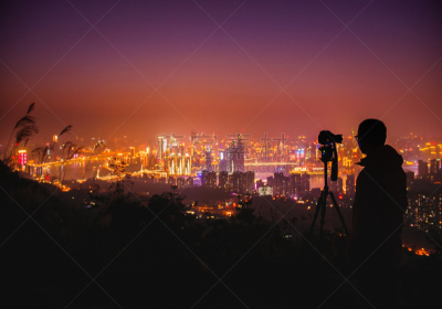 Photographer taking photos of Chongqing cityscape at night