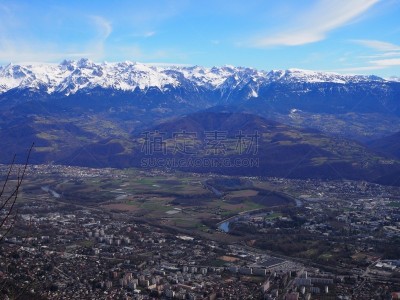 Grenoble, France – March 12, 2019: photography showing the Alps mountain and the villages surrounding the city of Grenoble, France. The photography was taken in the city of Grenoble, France.