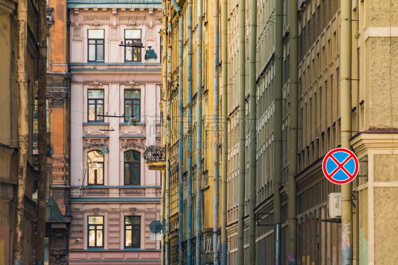 Row of historic buildings stretching into perspective