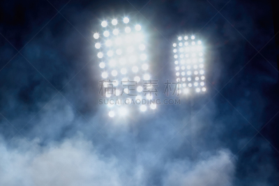 stadium lights and smoke