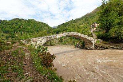 medieval stone bridge over a river in Adjara.