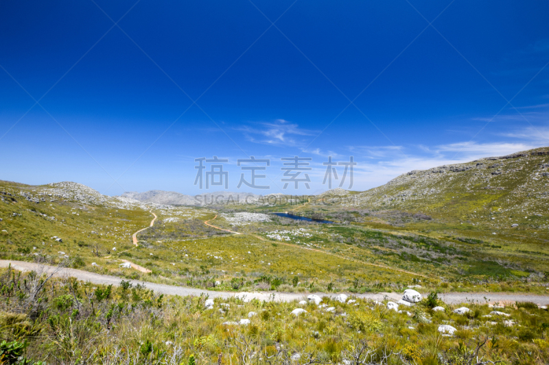 Beautiful view of a hiking trail in Silvermine Nature Reserve, part of the Table Mountain National Park in Cape Town, South Africa. The Silvermine reservoir in the background.