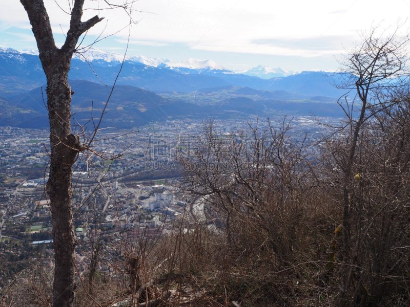 Grenoble, France – March 12, 2019: photography showing the Alps mountain and the villages surrounding the city of Grenoble, France. The photography was taken in the city of Grenoble, France.