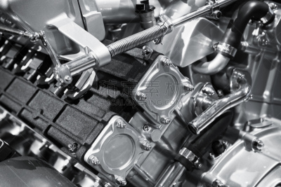 V12 car engine fragment, closeup photo