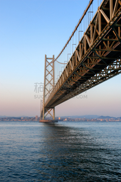 The Akashi Kaikyō Bridge, also known as the Pearl Bridge, links the city of Kobe on the mainland of Honshu to Iwaya on Awaji Island, in Japan. It crosses the busy Akashi Strait. It carries part of the Honshu-Shikoku Highway.Since its completion, in 1998,T