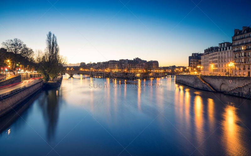 The Île Saint-Louis during the blue hour, Paris, France. View from the Pont d'Arcole