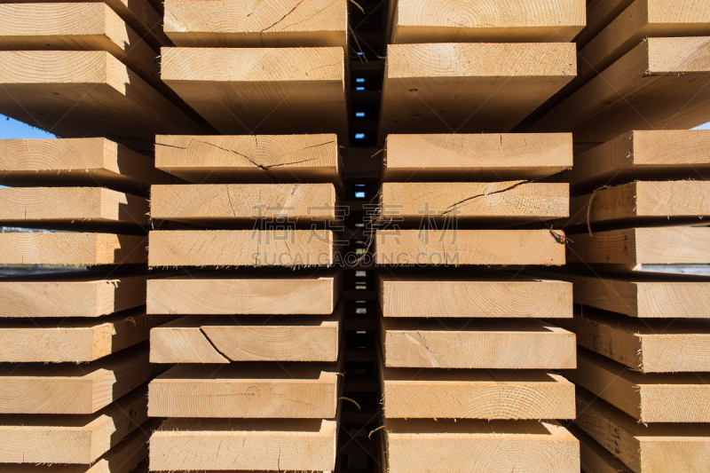 Stack of new wooden studs at the lumber yard