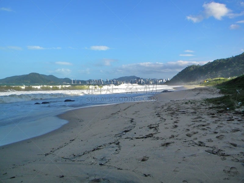 Beautiful pictures of the beautiful beach of Balneário Camboriú, with its imposing buildings, blue sea, sailboats, speedboats, extreme sports and great nightlife. An unforgettable summer season. Photo taken on the beach of Camboriú, Santa Catarina, Brazil