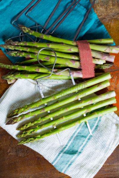 Green young asparagus shoots â premium healtry food, ready to cook and for grill
