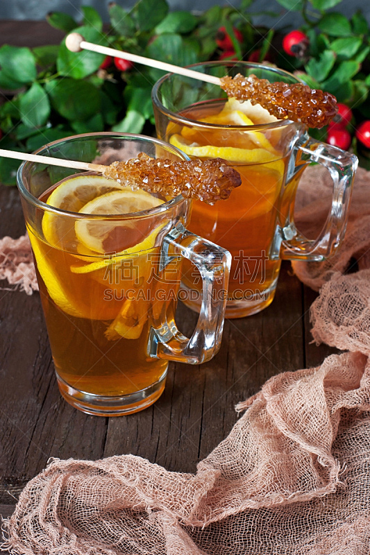 Cups of  tea with lemon on wooden tray