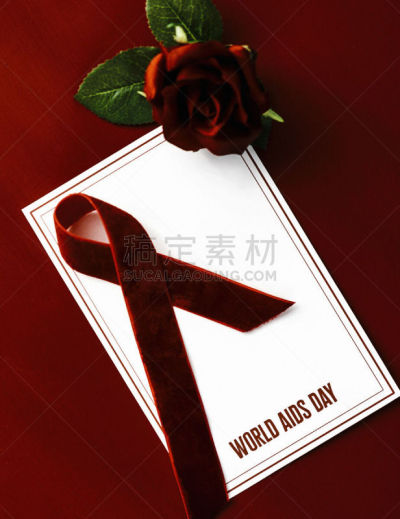 世界艾滋病日,红色背景,艾滋病警示丝带,垂直画幅,留白,无人,符号,明亮,社会意识符号,概念象征