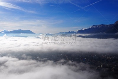 Grenoble, France – December 23, 2018: photography showing a sea of clouds above the city of Grenoble during a morning of december. The photography was taken at La Bastille viewpoint. La Bastille is a fortress culminating at 476 m (1,561ft) above sea level