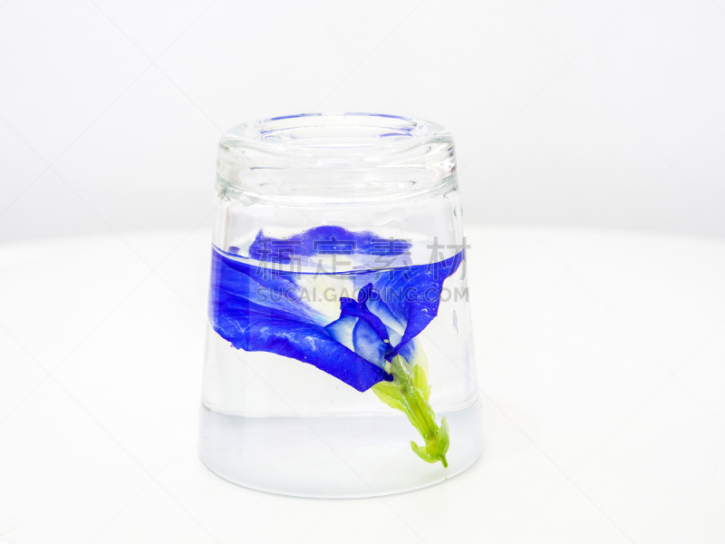 Purple Crake flowers in a small glass.