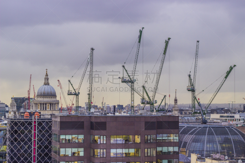 Construction cranes and St Paul's cathedral