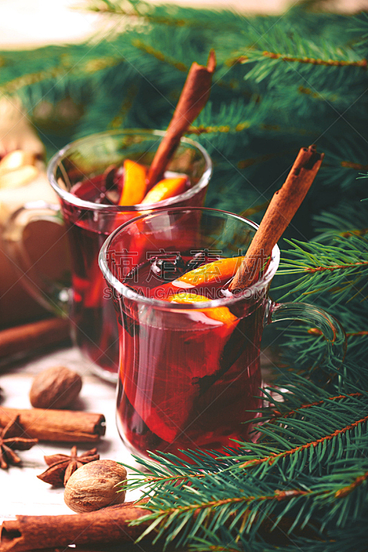 Hot mulled wine. Christmas tree branches, gifts and cones