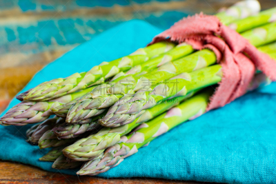 Green young asparagus shoots â premium healtry food, ready to cook and for grill