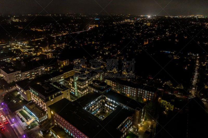 Aerial view of Hamburg at night, Germany. Christmas time. Wandsbek station. City traffic. Christmas decorations. Aerial footage. Night.